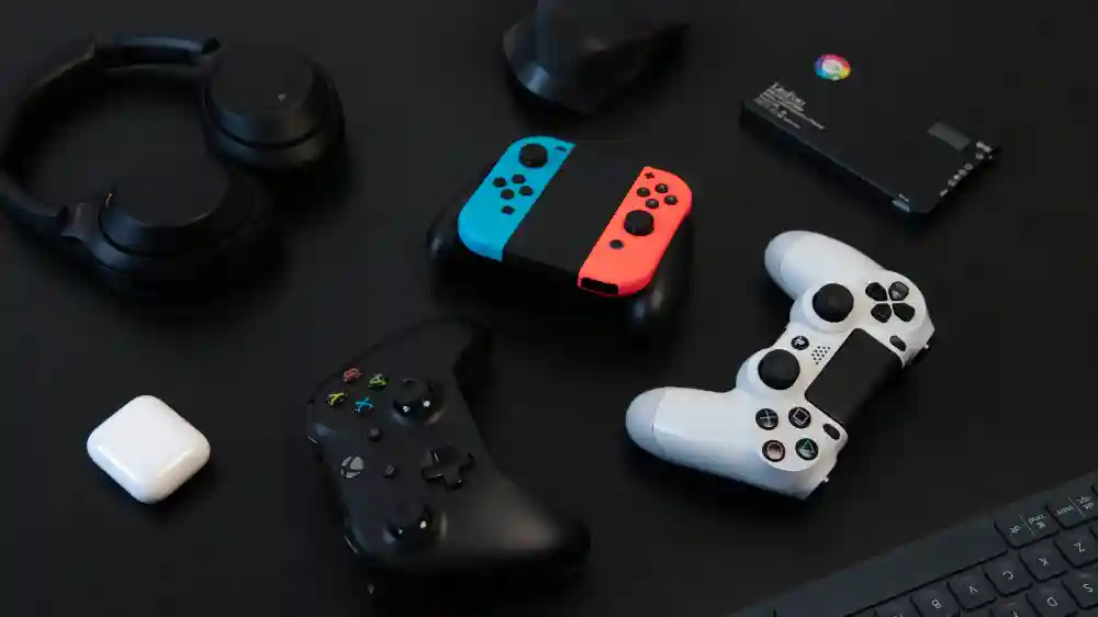 PlayStation, Xbox and Nintendo Switch controllers with earbuds